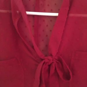 Red blouse with ties.